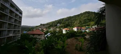 a view of a town with a mountain in the background at Chic B309 in Karon Beach