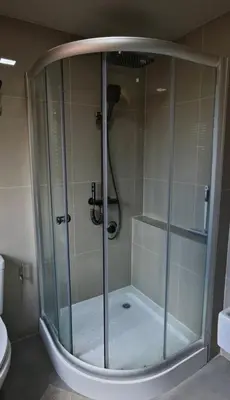 a shower with a glass door in a bathroom at Palm Spring 301 in Patong Beach