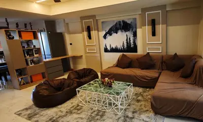 a living room with a couch and a table at Palm Spring 301 in Patong Beach