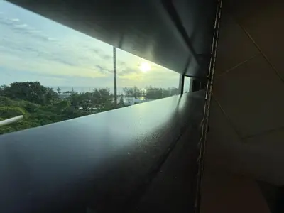 a view from a window of a building at Cozy 2BR Apartment in The Proud Karon Beach in Karon Beach