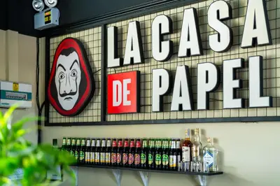 a sign that says laaza de papel on a wall at Whoopers Hostel Ao Nang - By The Beach in Ban Khlong Haeng