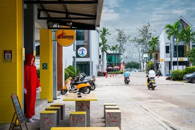 a group of people riding motorcycles on a street at Whoopers Hostel Ao Nang - By The Beach in Ban Khlong Haeng