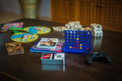 a table with games and other toys on it at Villa Vie Phuket Rawai 3 Bedrooms in Ban Saiyuan (1)