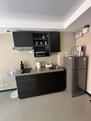 a kitchen with a stainless steel refrigerator and a sink at Комфортные апартаменты Пхукет NBC in Rawai Beach