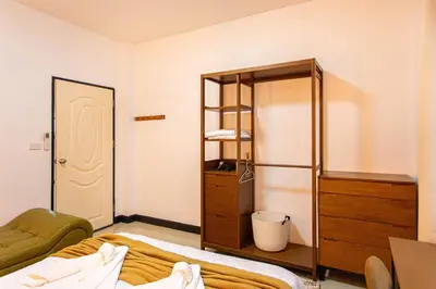 a bedroom with a bed and a dresser and a mirror at Kathu V pool villa 170 in Kathu