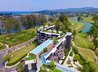 an aerial view of a resort with a swimming pool at Bangtao Rooftop Seaview Laguna Skypark Condominium in Bang Tao Beach
