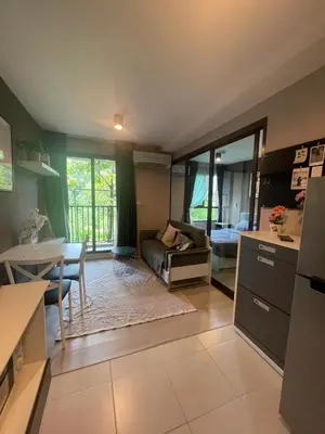 a kitchen and living room with a couch and a table at Zcape garden view Phuket in Ban Rangeng