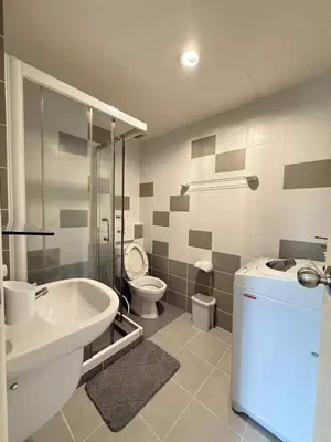 a bathroom with a sink and a toilet and a shower at Zcape garden view Phuket in Ban Rangeng