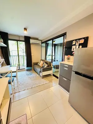a kitchen and living room with a couch and a table at Zcape garden view Phuket in Ban Rangeng
