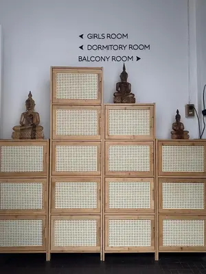 a group of wooden doors in a room at Beanstay hostel in Phuket Town