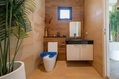 a bathroom with a toilet and a sink at Rawai Park Big Garden Villa 3D10 in Rawai Beach