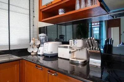 a kitchen with a counter with appliances on it at Rawayana Beach Villa 3D14 in Phuket Town