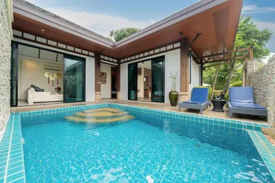 a swimming pool in the backyard of a house at Rawayana Beach Villa 3D14 in Phuket Town