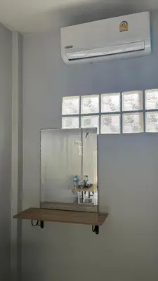 a sink in a glass tank on a wall at Gypsy Village Resort in Phi Phi Don