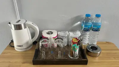 a tray with two bottles of water and a blender at Gypsy Village Resort in Phi Phi Don