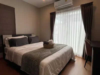 a bedroom with a bed with a basket on it at Modern 3 BR Villa Pool&Gym only 15min to Bang Tao Beach in Ban Phru Champa