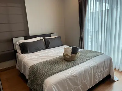 a bedroom with a bed with a basket on it at Modern 3 BR Villa Pool&Gym only 15min to Bang Tao Beach in Ban Phru Champa
