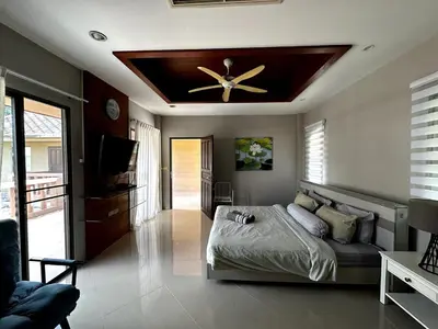 a bedroom with a bed and a ceiling fan at Casa Sakoo pool Villa Naithon in Nai Thon Beach
