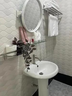 a bathroom with a sink and a mirror at 3P Phuket Airport Hotel in Phuket