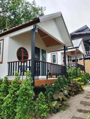 a small white house with a porch at The white resort & restaurant koh yao yai in Ban Khlong Hia