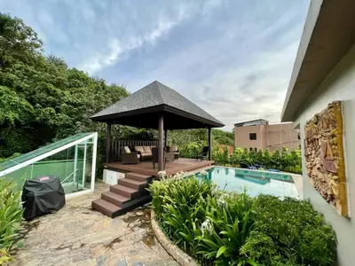 a backyard with a gazebo and a swimming pool at Karon Beach Seaview Penthouse With Private Pool Condominium in Karon Beach