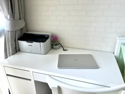 a white desk with a printer and a laptop on it at Halo 1 , 2 bedroom, 400m to the see in Nai Yang Beach