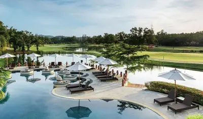 an image of a resort pool with chairs and umbrellas at Laguna Park 5 bedroom villa with pool in Laguna Phuket near the beach in Laguna Phuket