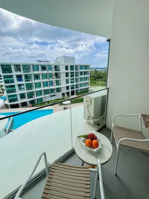 a bowl of fruit on a table on a balcony at La Vita 5 star Super 1 Bdr Nai Harn Beach in Rawai Beach