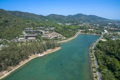 an aerial view of a resort next to the water at The Lago Nai Harn 2 BR-Walk to beach by ALL HOMES in Rawai Beach