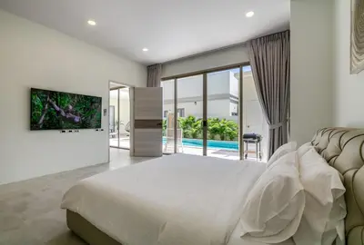 a bedroom with a large bed and a pool at Villa Orion at Orbita Villas Rawai in Rawai Beach