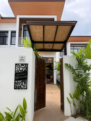 a entrance to a house with a sign on the door at Goldena Residence Pool Villas in Kamala Beach