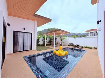 a pool with an inflatable rubber duck in a house at Goldena Residence Pool Villas in Kamala Beach