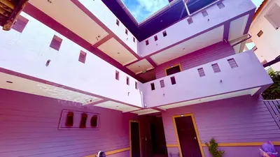 a pink house with awning on top of it at Hill Side Patong in Patong Beach