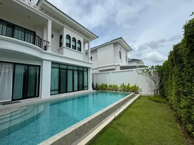 a swimming pool in the backyard of a house at Вилла на Бангтао in Ban Thalat Choeng Thale