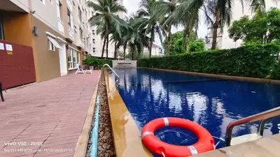 a swimming pool with a red raft in a building at No 498 SPD in Phuket Town
