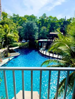 a view of a swimming pool from a balcony at naiyang beach in Phuket