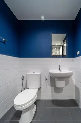 a bathroom with a white toilet and a sink at 1BR Designer Mountain View Condo - Central Phuket in Phuket Town