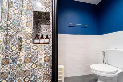 a bathroom with a toilet and a shower at 1BR Designer Mountain View Condo - Central Phuket in Phuket Town