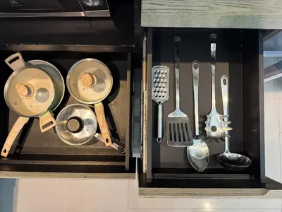 a drawer full of kitchen utensils in a cabinet at Kamala City Gate 1 Bdr Pool View in Kamala Beach