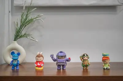 a group of toy figurines sitting on a shelf at Stylish 3 Bedroom Villa with Garden, Chalong - by PoshSaga in Chalong