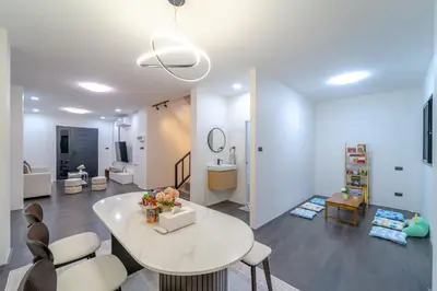 a living room with a white table and chairs at Stylish 3 Bedroom Villa with Garden, Chalong - by PoshSaga in Chalong
