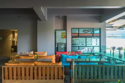 a lobby with couches and a glass table at Private apartment at Emerald Terrace by Lofty in Patong Beach