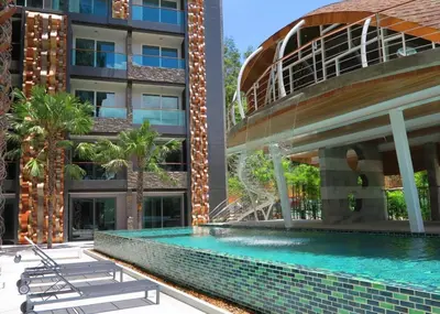 a swimming pool in front of a building at Private apartment at Emerald Terrace by Lofty in Patong Beach