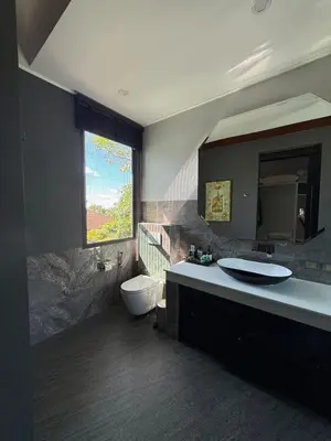 a bathroom with a sink and a toilet and a mirror at Luxury Pool Villa Near Laguna - Gym, Jacuzzi & Cinema in Phuket
