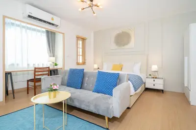 a living room with a couch and a bed at 2Rooms apartment in Bangla Patong in Patong Beach
