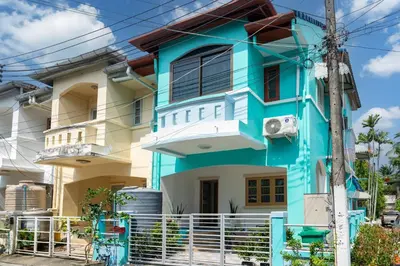 a blue and white house at 2Rooms apartment in Bangla Patong in Patong Beach