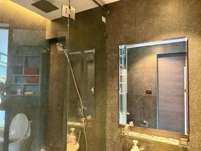 a bathroom with a shower with a mirror and a sink at Room in Kamala at Citygate Condo in Kamala Beach