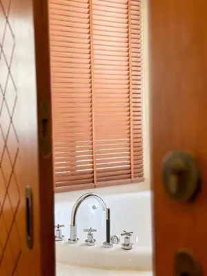 a bathroom with a sink and a window at La Nissta Villa 4bdr pool Villa Phuket in Koh Lone