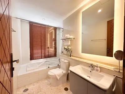a bathroom with a toilet and a sink and a tub at La Nissta Villa 4bdr pool Villa Phuket in Koh Lone