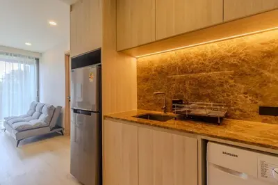 a kitchen with a sink and a counter top at C240 New Prime Location 1BR Condo Near Beach Club in Thalang